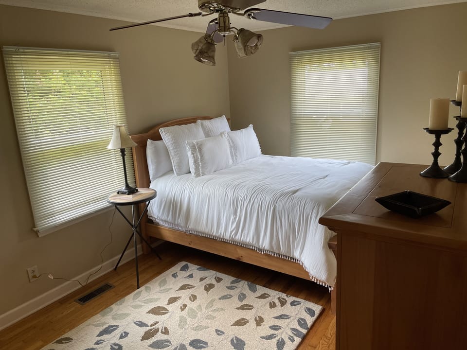 1st bedroom with queen bed, dresser, mirror, chest of drawers and closet