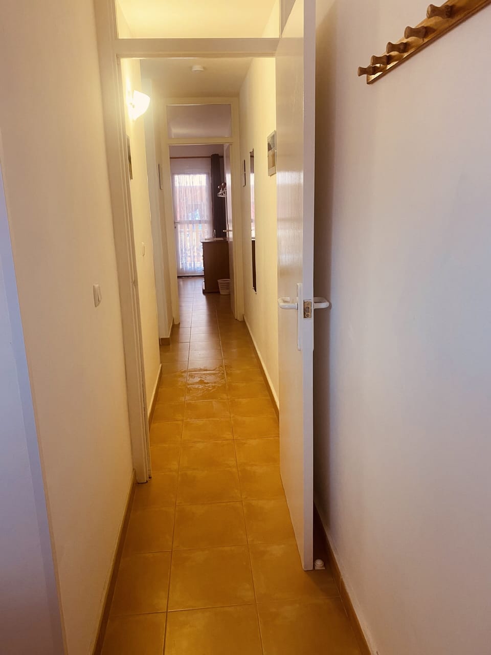 Hall way downstairs connecting bedrooms and bathroom.