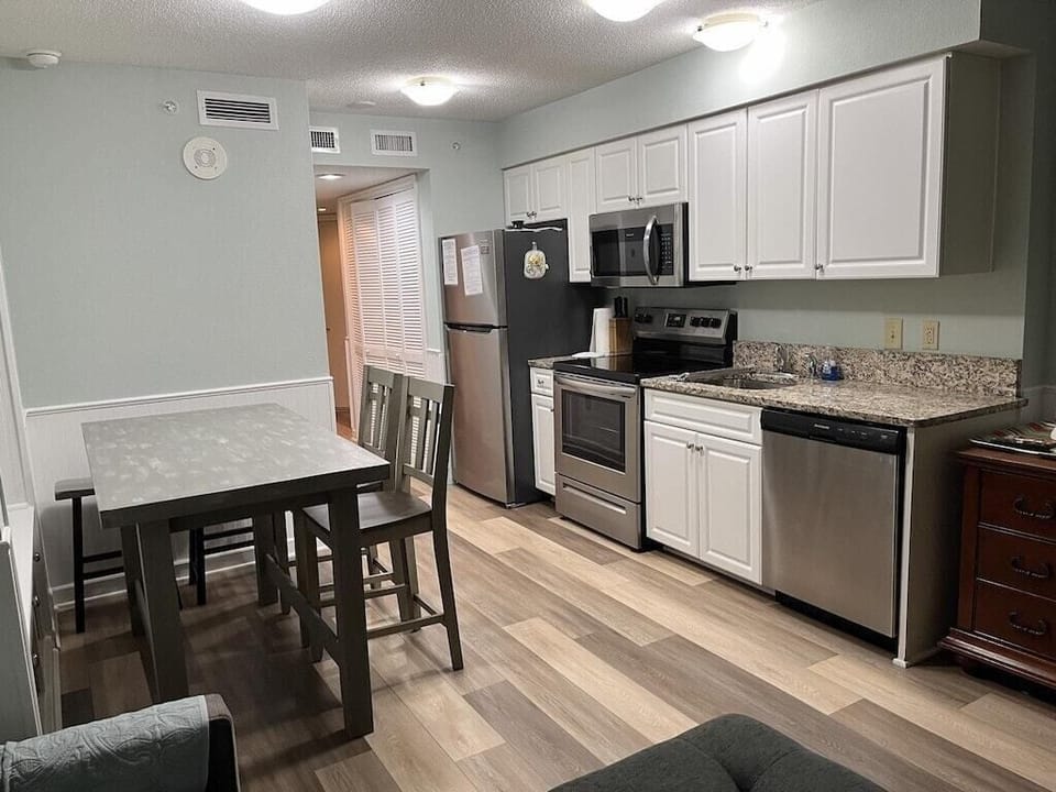 Stainless steel appliances with beautiful granite countertop