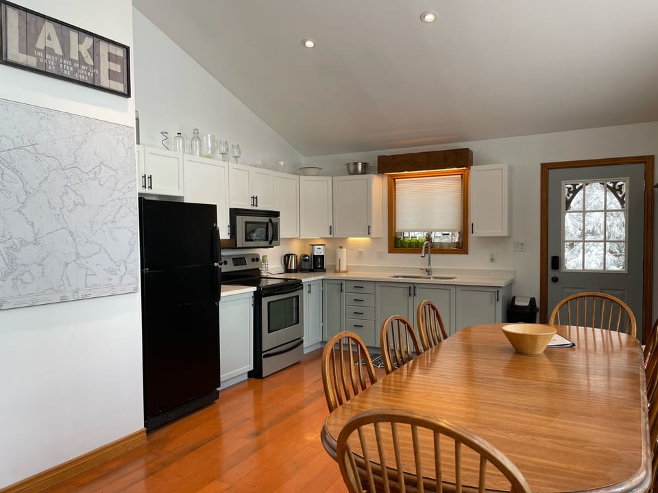 Kitchen and large  dining table with 8 chairs 