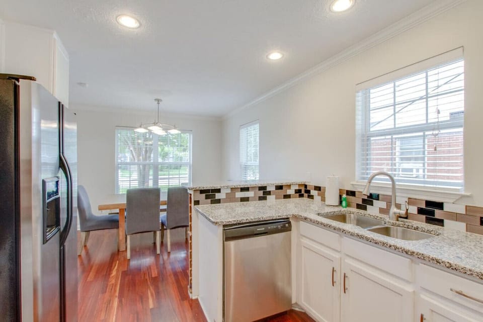 Well-appointed kitchen with granite counters and stainless steel appliances.