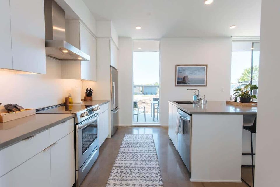 Each kitchen is equipped with everything you need to prepare a meal for your group, with quartz counter tops and breakfast bar seating for 6.