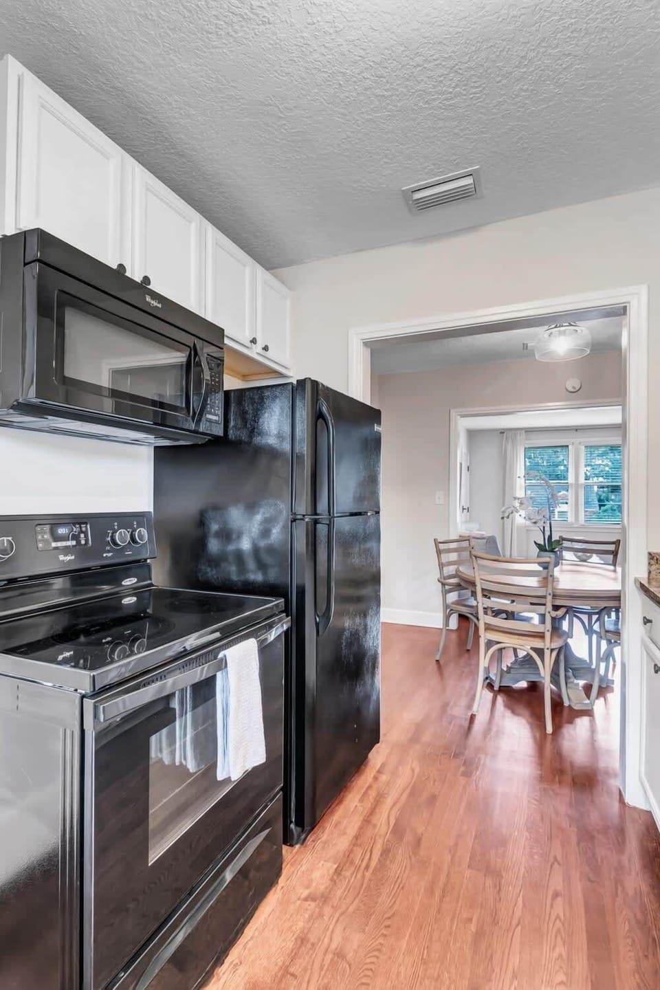 Crisp kitchen area equipped with everything you need for a home-cooked meal.