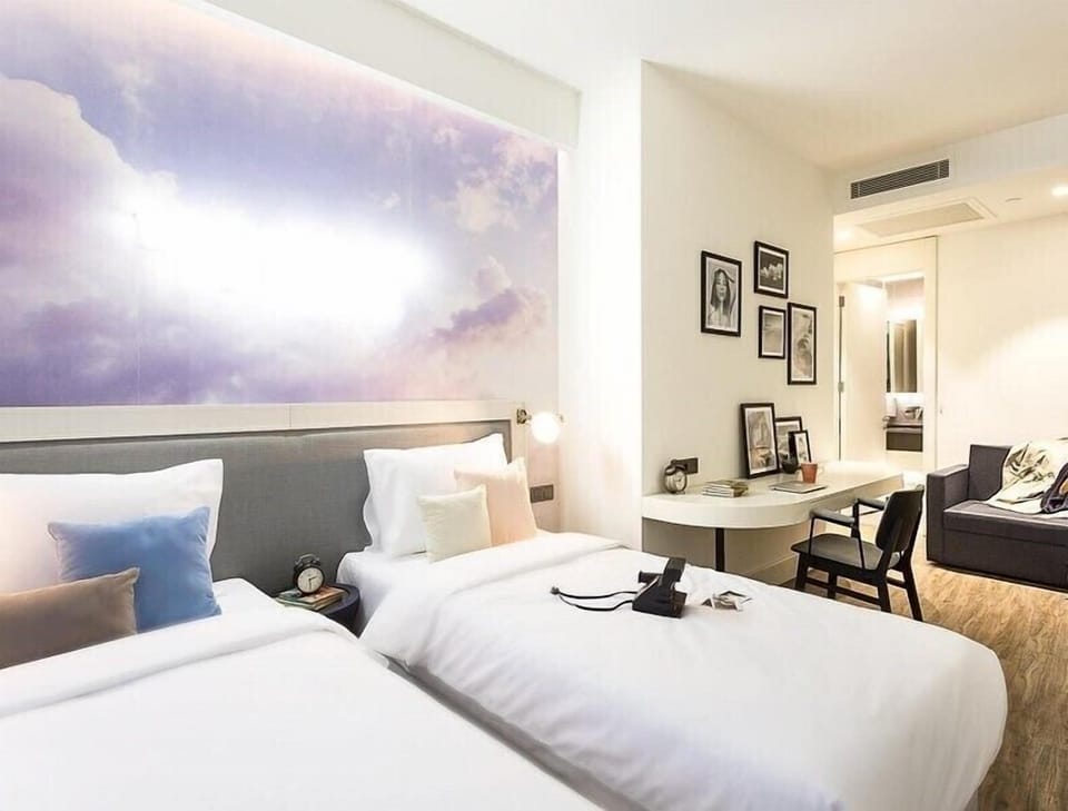 Superior Twin Room | Minibar, in-room safe, desk, laptop workspace