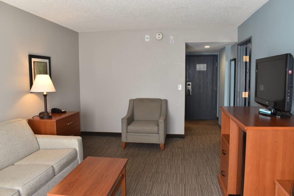 Suite, Multiple Beds, Non Smoking | Desk, laptop workspace, blackout drapes, iron/ironing board