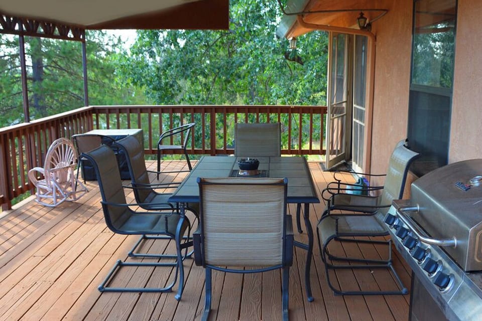 Deck table seats 6. More seating behind. 2 BBQs on deck, 5 and 2 burner sizes.