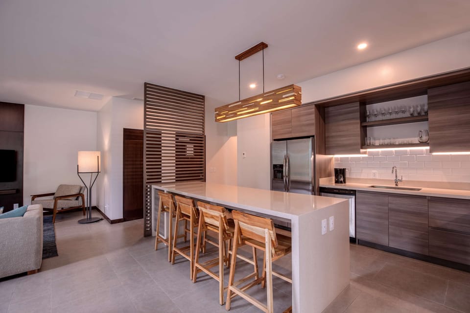Suite, Multiple Beds, Garden View | Private kitchen | Coffee/tea maker, fridge, microwave
