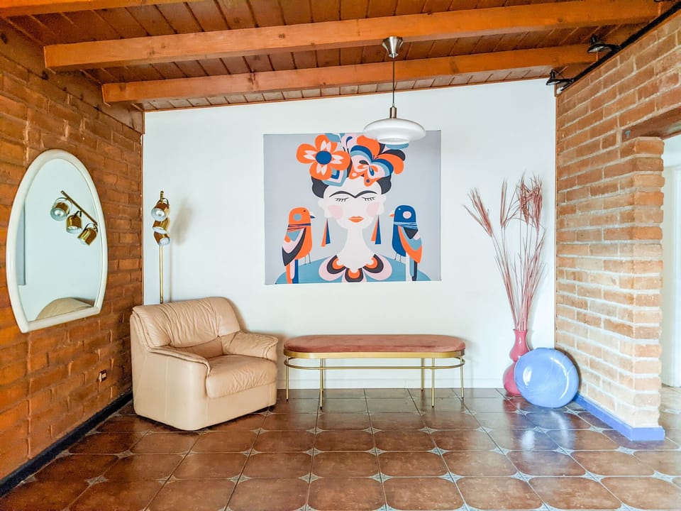 Entry way with additional seating.
