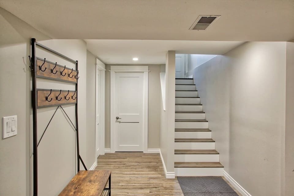 Stairway to the main level and back door entrance