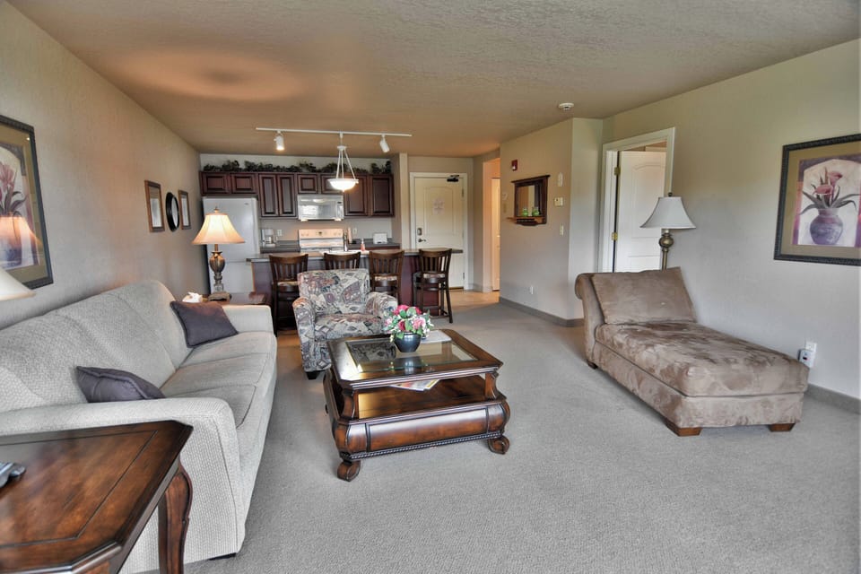 Condo, 1 Queen Bed with Sofa bed, Jetted Tub | Living area | 32-inch TV with cable channels