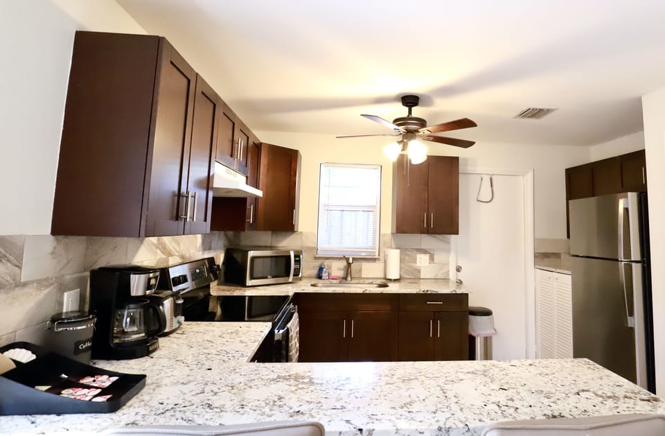 Fully equipped kitchen with stainless steel appliances. 