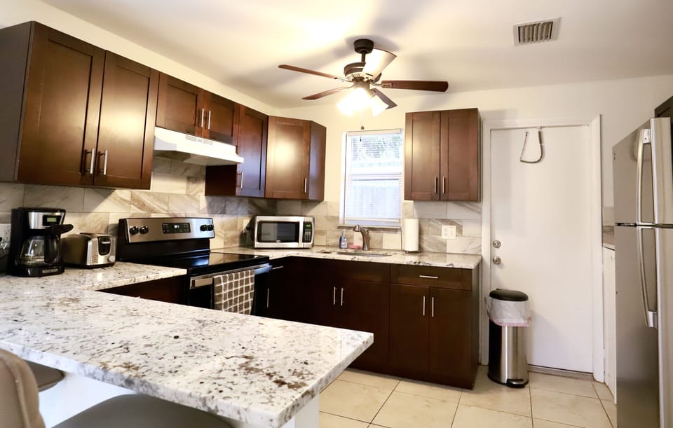 Fully equipped kitchen with stainless steel appliances. 