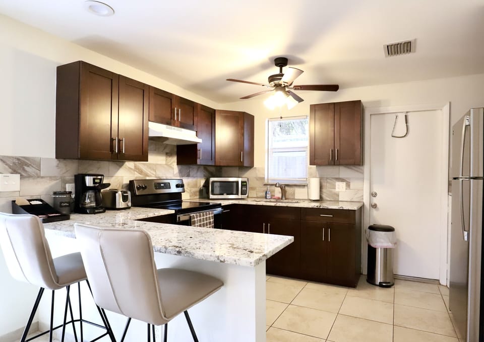 Fully equipped kitchen with stainless steel appliances. 