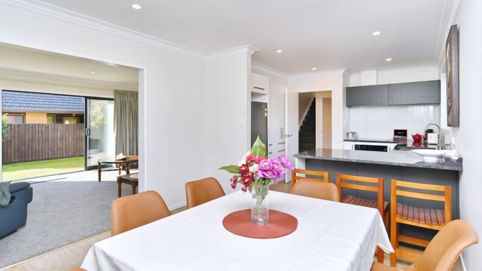 Pull up a chair. The dining table seats six, with the kitchen a step away.