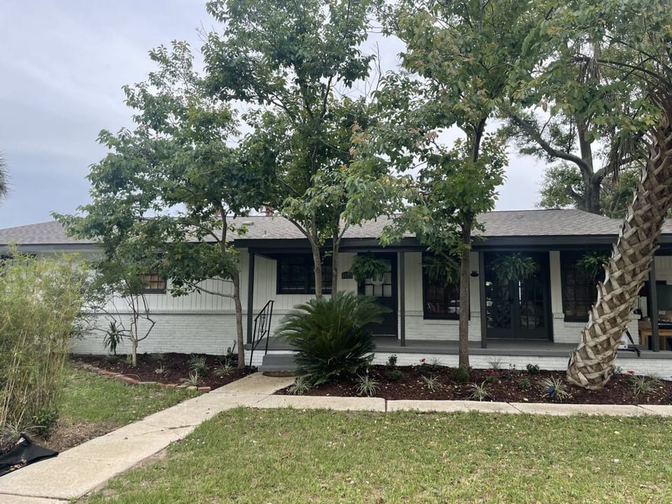 Street view - 3 bed/2 ba. mid-century home right on the water!!