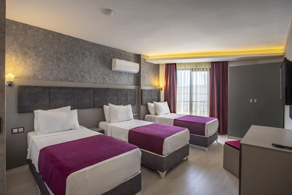 Standard Triple Room | Minibar, in-room safe, free WiFi, bed sheets
