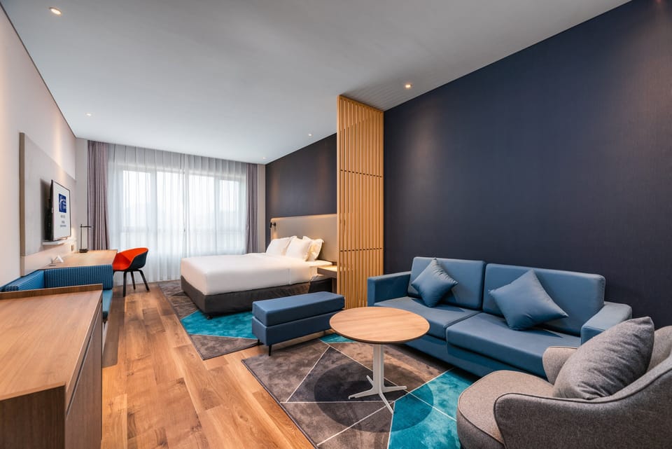 Standard Room, 1 King Bed (Extra Floor Space) | In-room safe, individually decorated, desk, blackout drapes