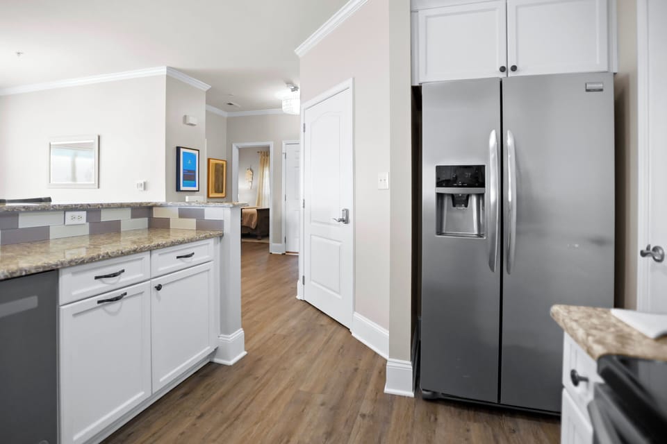 Fully stocked kitchen with seating for 3.