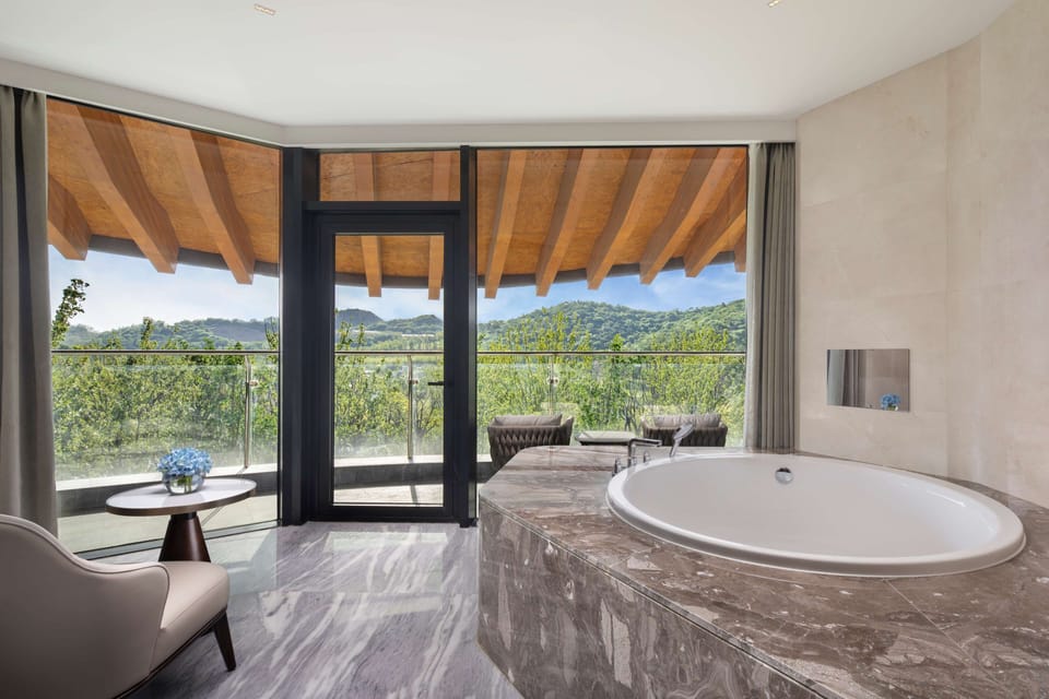 Executive Room (Collection) | Bathroom | Separate tub and shower, rainfall showerhead, eco-friendly toiletries