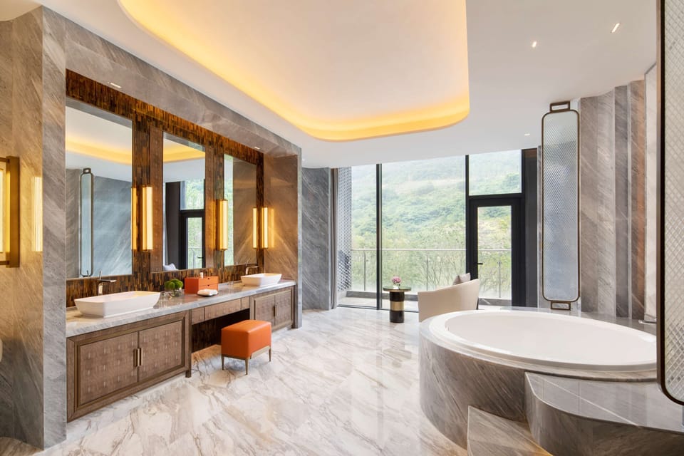 Separate tub and shower, rainfall showerhead, eco-friendly toiletries