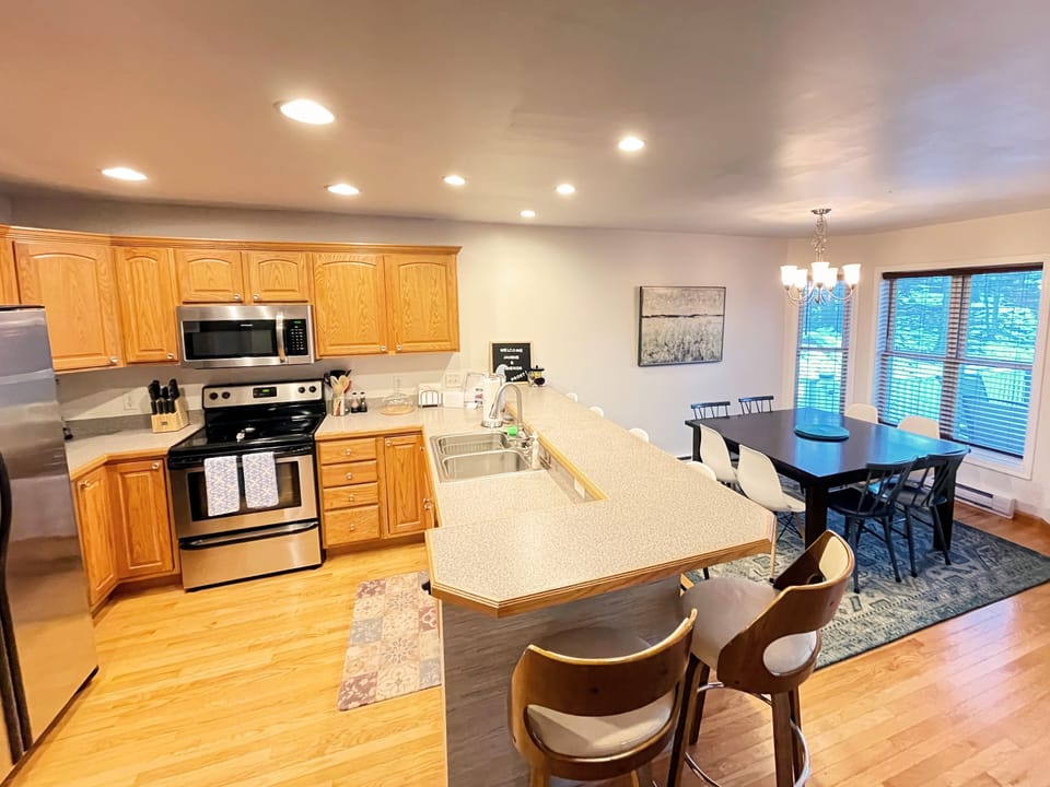 Spacious kitchen with bar