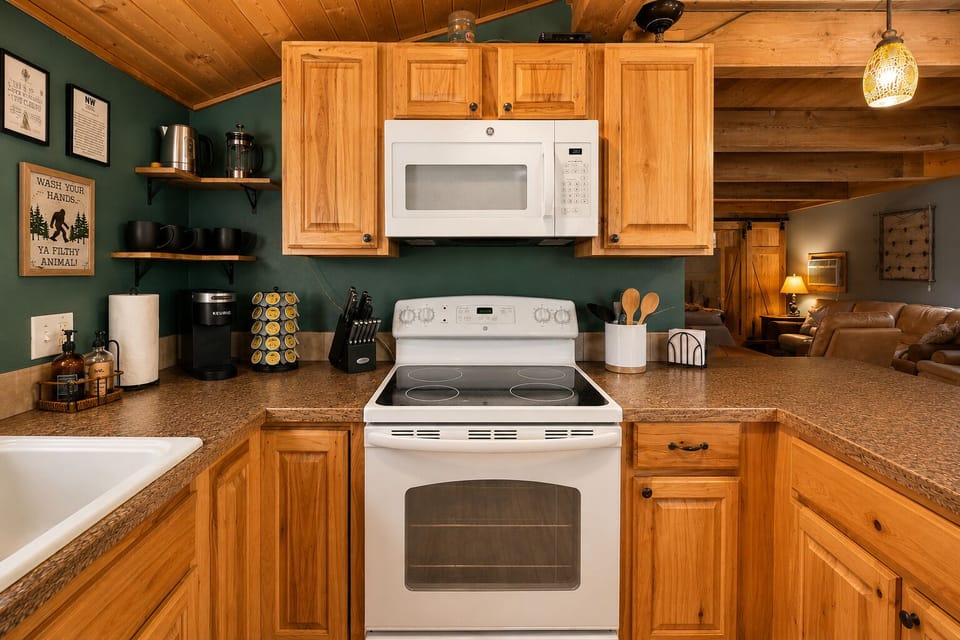 Kitchen includes a a full size stove, oven and microwave for your meals.