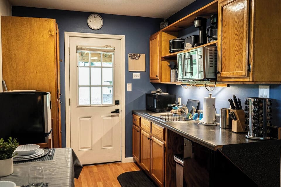 Kitchenette with fridge and freezer, crock pot, Keurig, microwave, toaster oven.