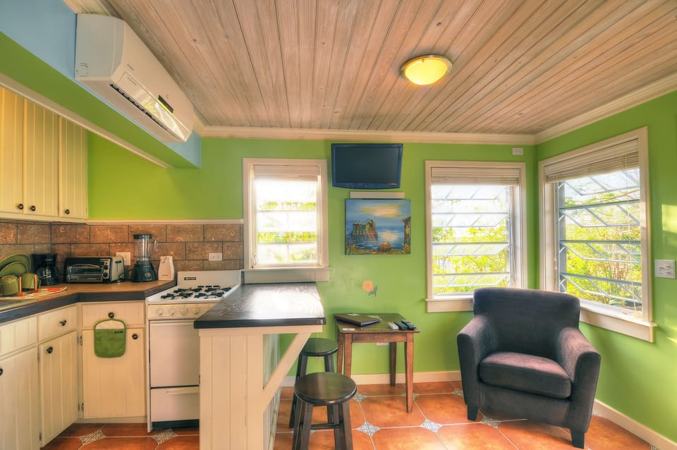 More kitchen area and small living room / seating area views.