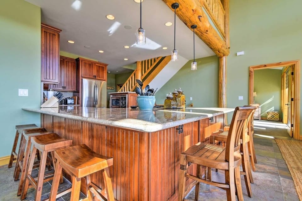  Kitchen includes 5 burner gas stove top with retractable vent, a wine fridge, french door fridge, dishwasher, oven and microwave