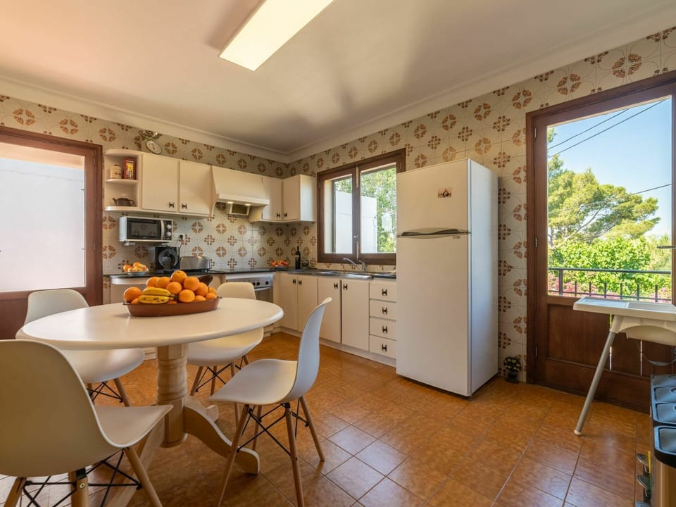 Furniture, Window, Cabinetry, Countertop, Chair, Table, Kitchen, Wood, Interior Design, Lighting