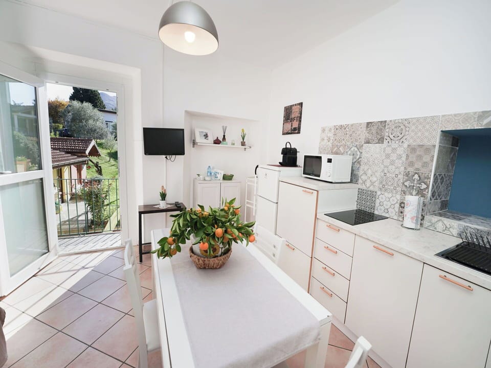 Furniture, Flooring, Interior Design, Kitchen, Floor, Major Appliance, Countertop, Kitchen Appliance, Cabinetry, Room