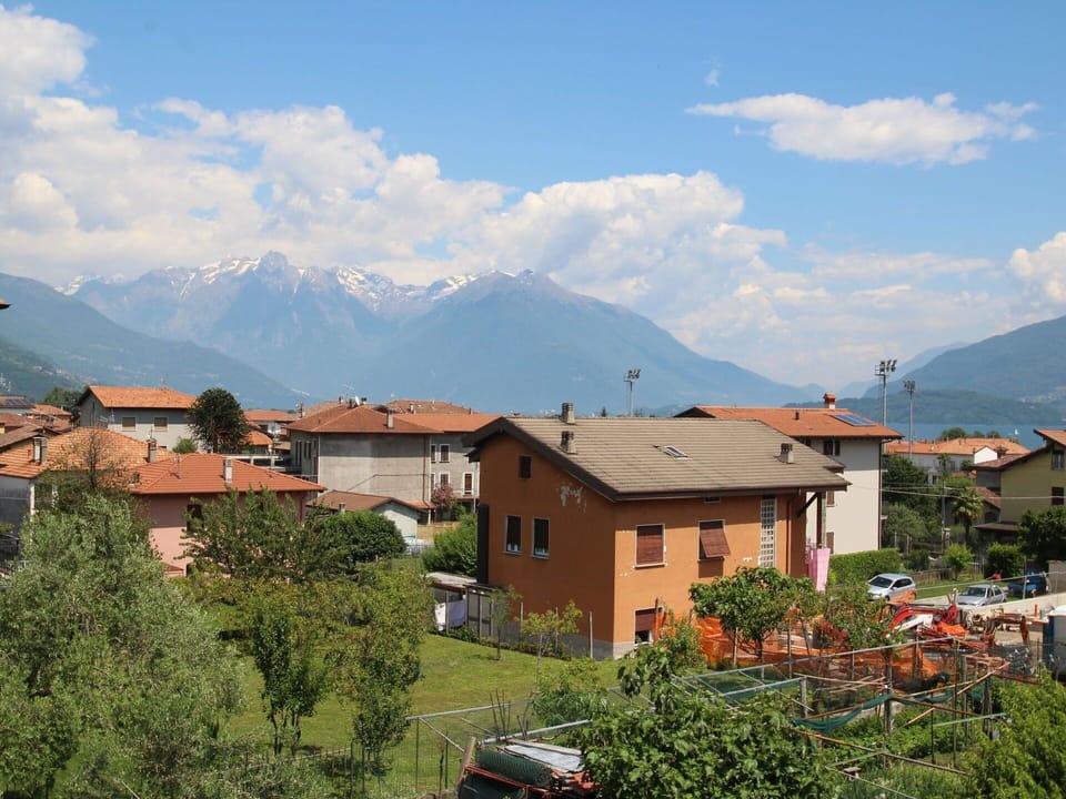 Cloud, Sky, Mountain, Building, Window, Tree, Highland, Plant, Cumulus, Residential Area