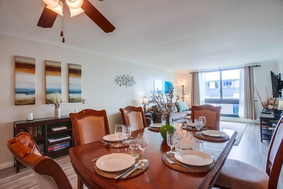 Dining and Living room with overhead light and ceiling fan