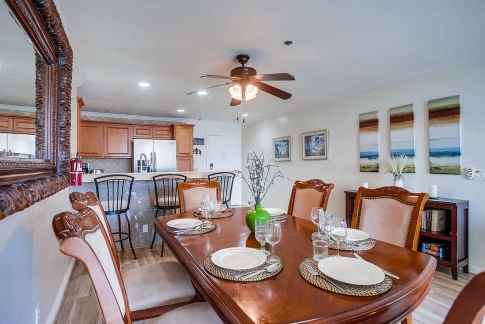 Dining table for 6 guests, and 3 seats along the breakfast bar (kitchen remodeled and shown separately)