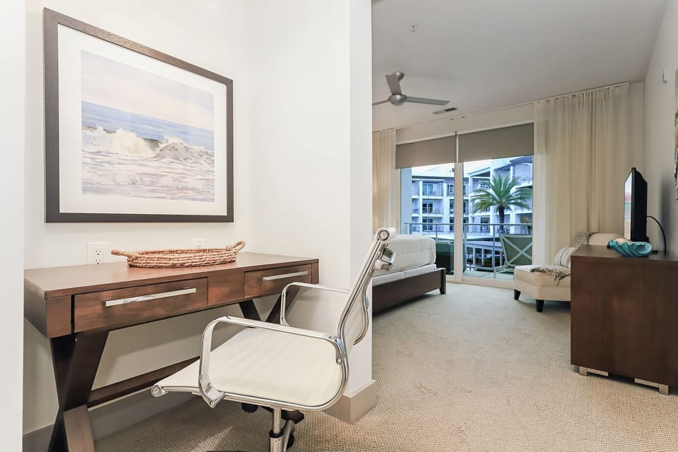 Master suite features an office nook w/ desk and chair