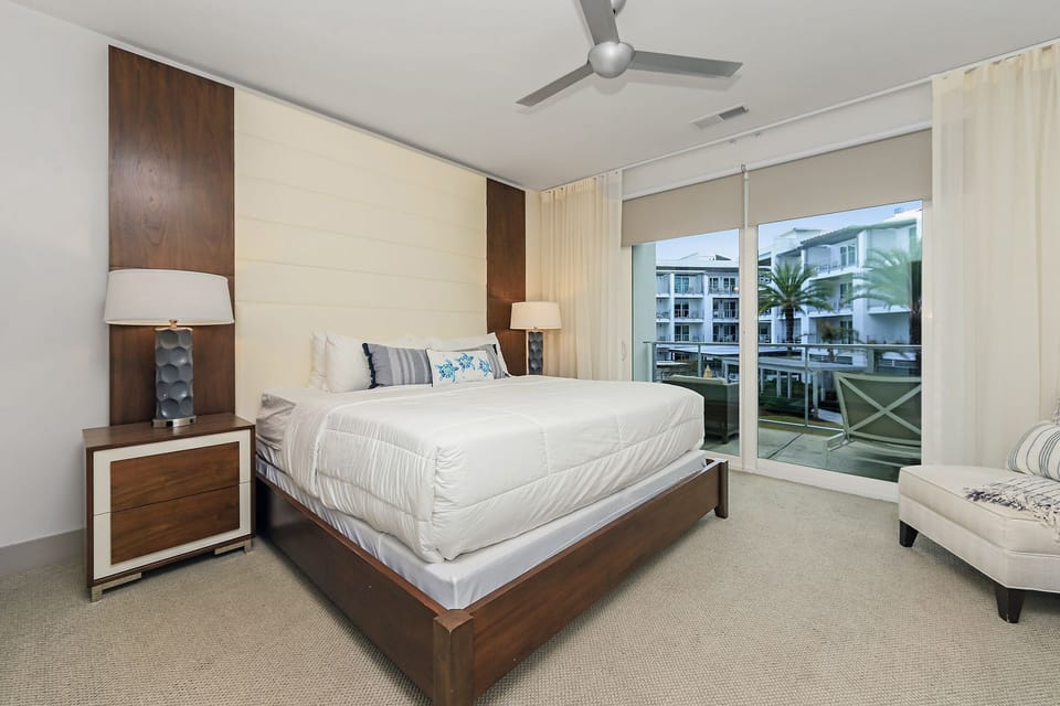 Master bedroom suite w/ private balcony access & outdoor seating