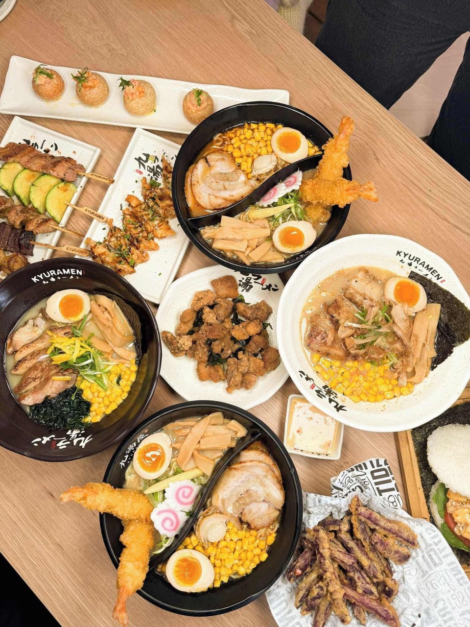 Warm up with a bowl at Kyuramen Nashville, a cozy ramen spot known for rich broths, comforting Japanese dishes, and signature honeycomb booths.