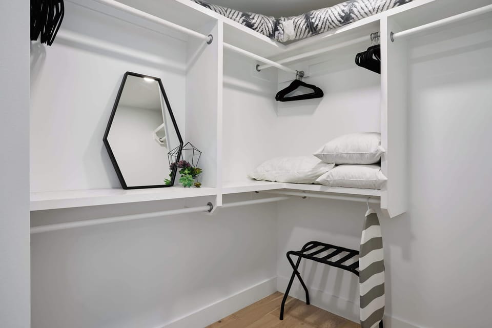 The huge walk in closet has ample room for everyone's outfit changes.