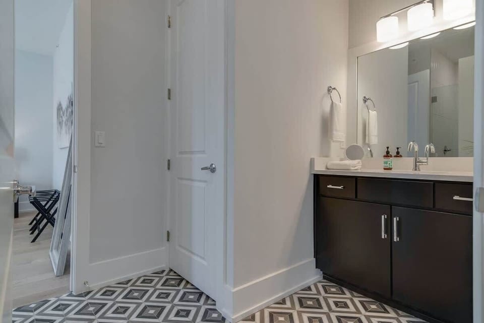 The bathroom opens to the main space for guests convenience.