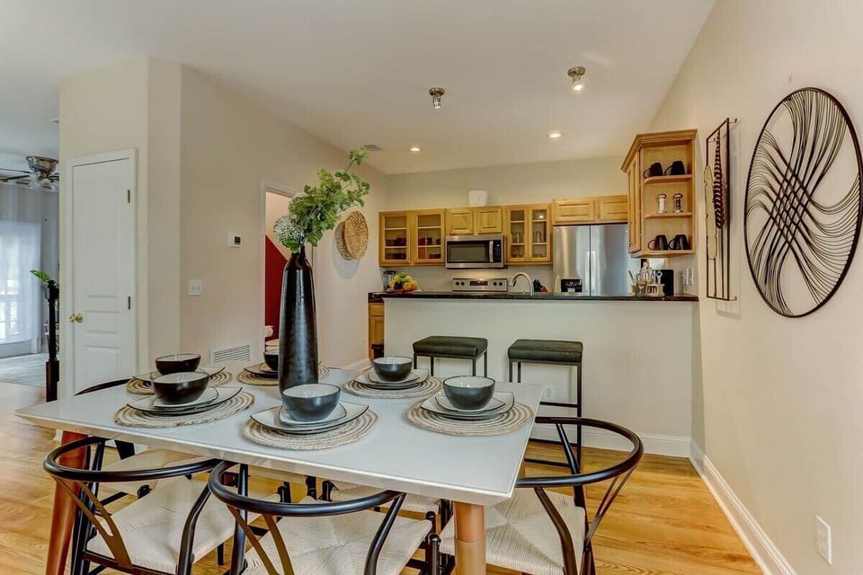 Views of the kitchen from the dining room table.