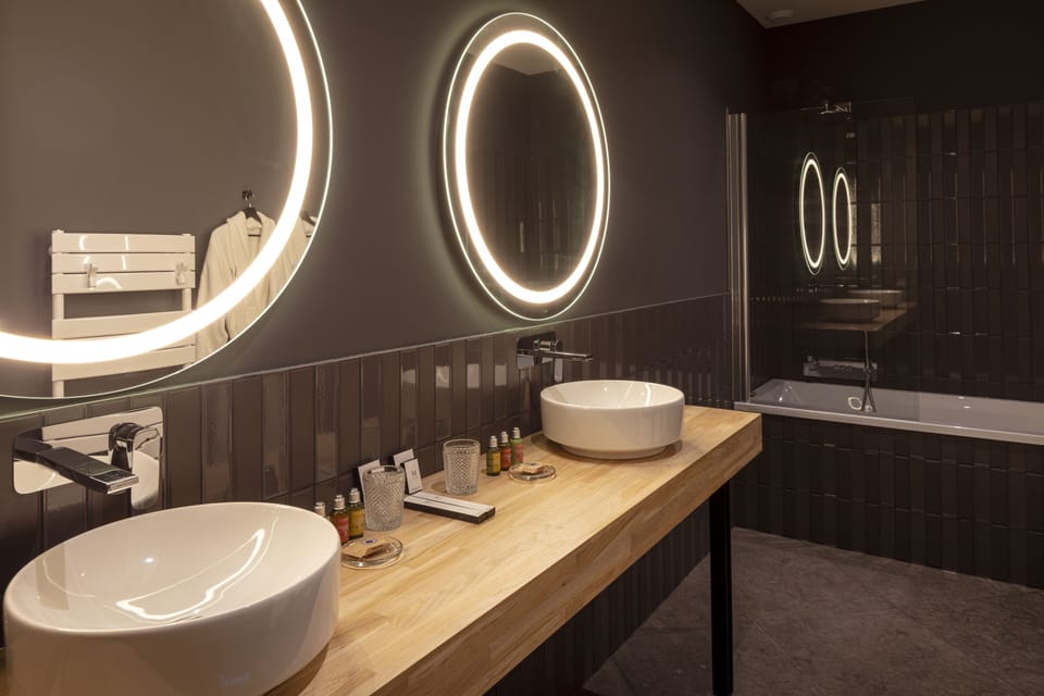 Presidential Suite | Bathroom | Designer toiletries, hair dryer, bathrobes, slippers