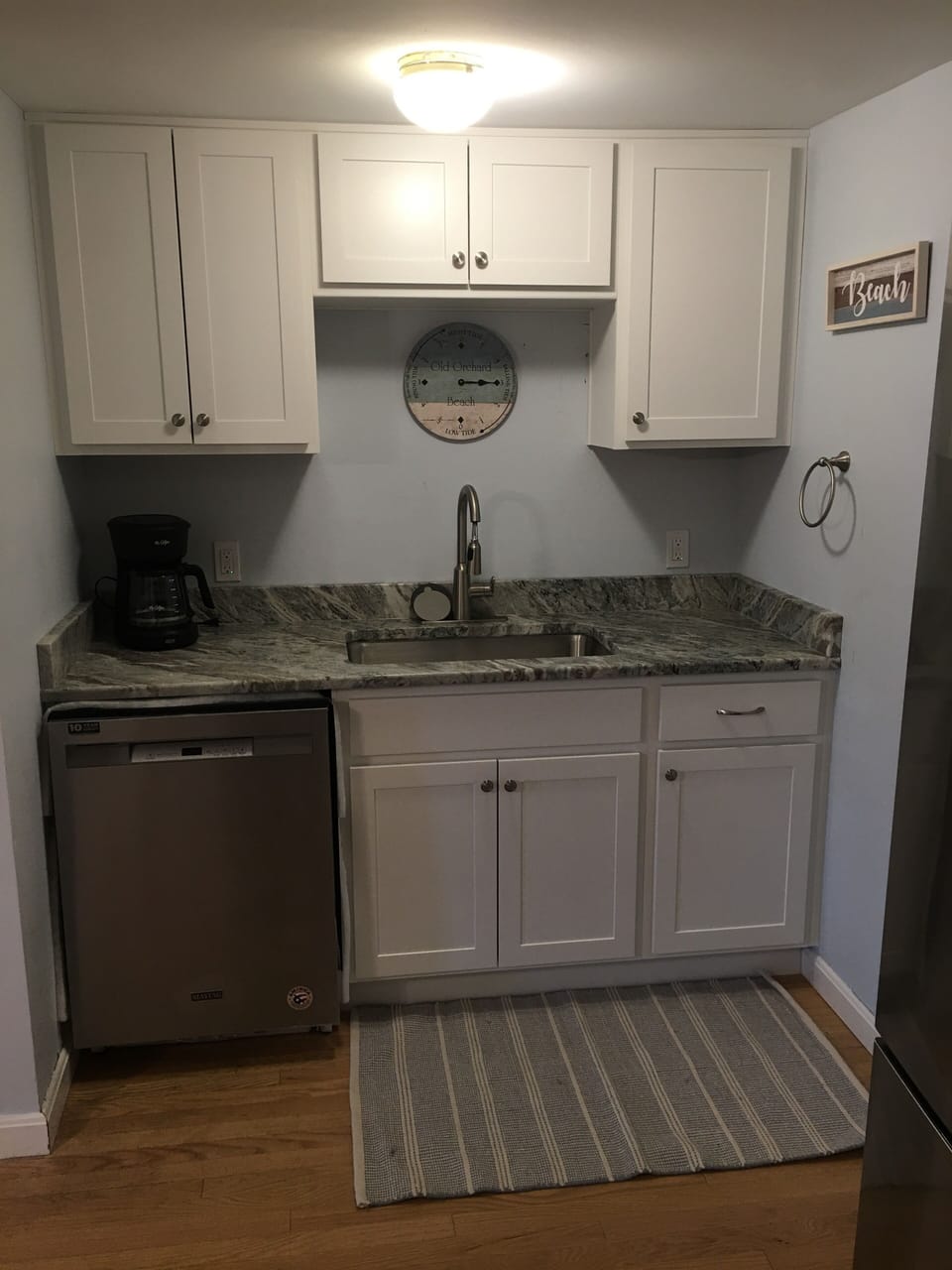 Kitchen with brand new cabinets, sink, countertops, and dishwasher 