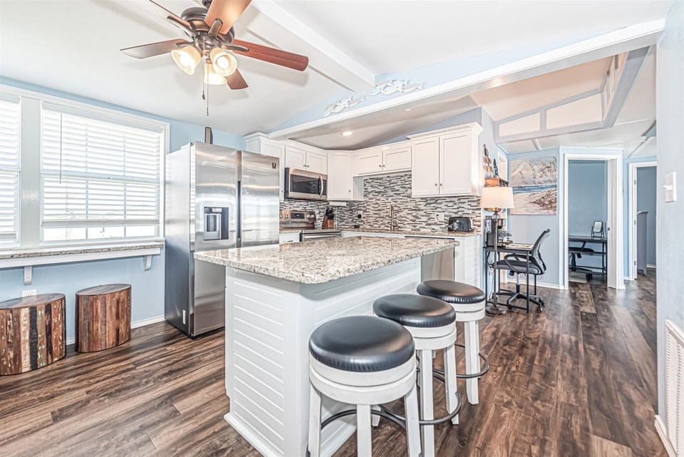 Countertop seating area with seating area under window pane also