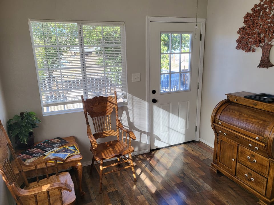 Top of the stairs Foyer to Rooms, w/ Roll Top Desk & door to upstairs balcony 