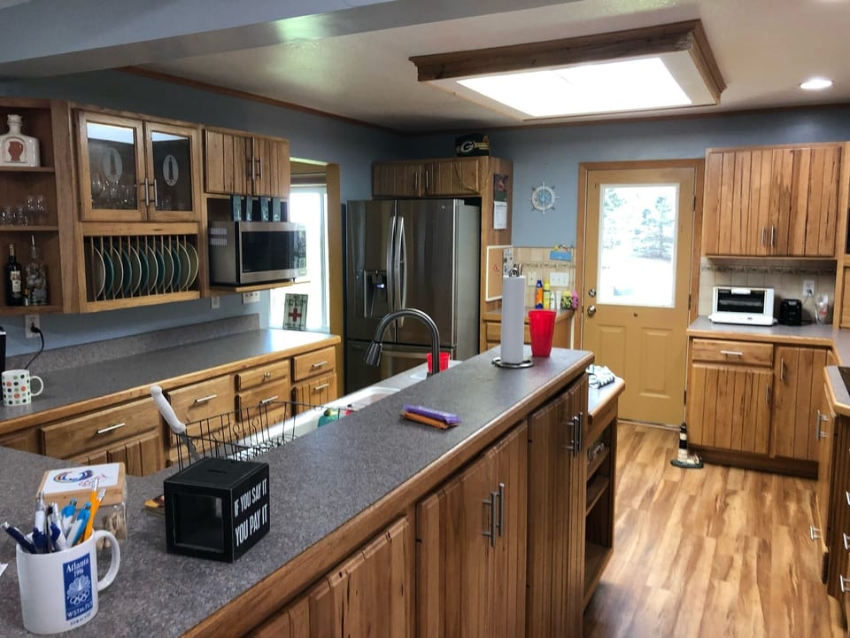 Kitchen facing side door to the deck