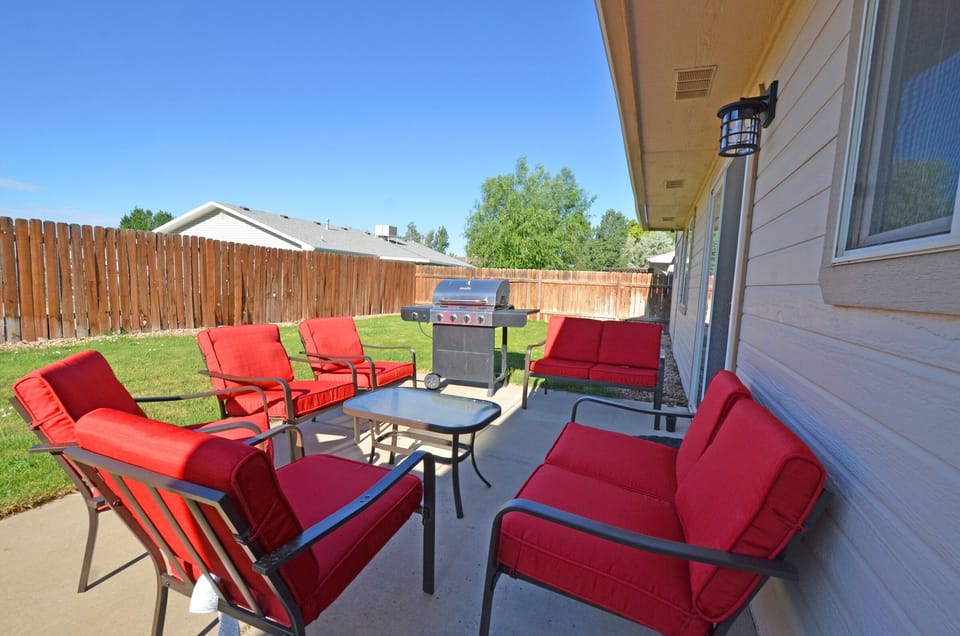 Enjoy a drink in the large backyard seating area, or cook a meal on the grill.