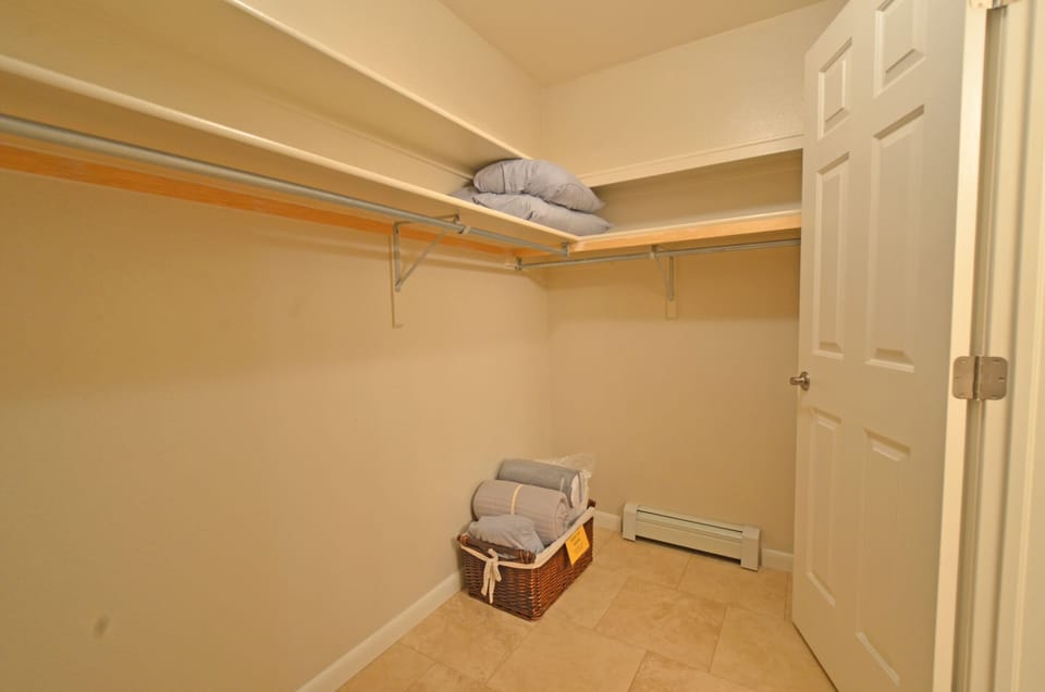 The large master closet has plenty of space and holds the sleeper bedding.