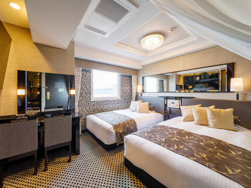 Deluxe Twin Room, Non Smoking | Down comforters, desk, free WiFi, bed sheets