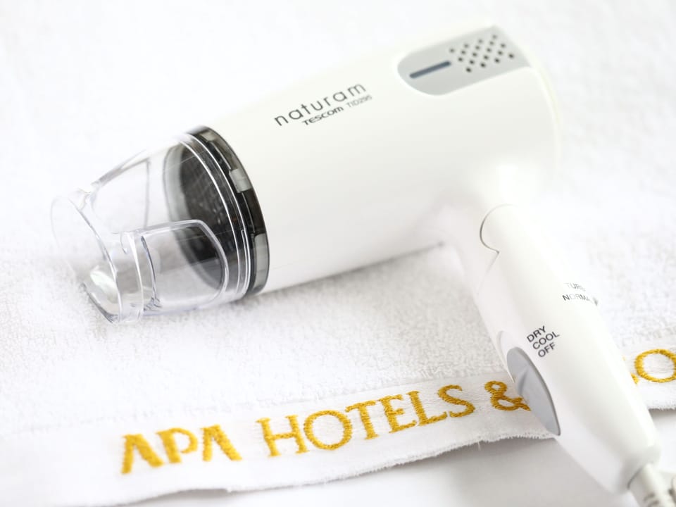 Combined shower/tub, eco-friendly toiletries, hair dryer, slippers
