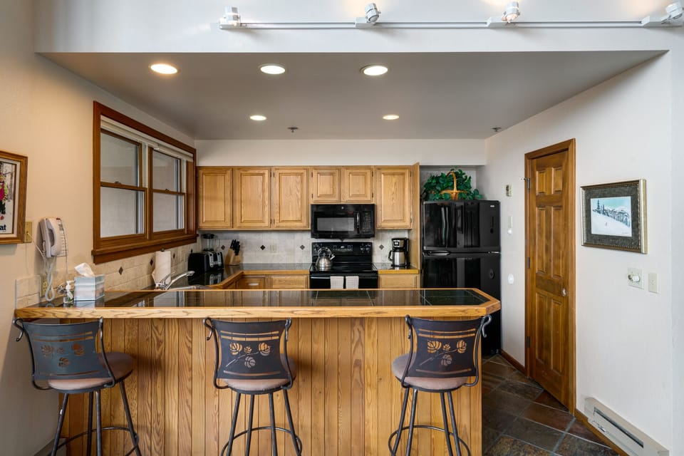 Kitchen with breakfast bar for three.